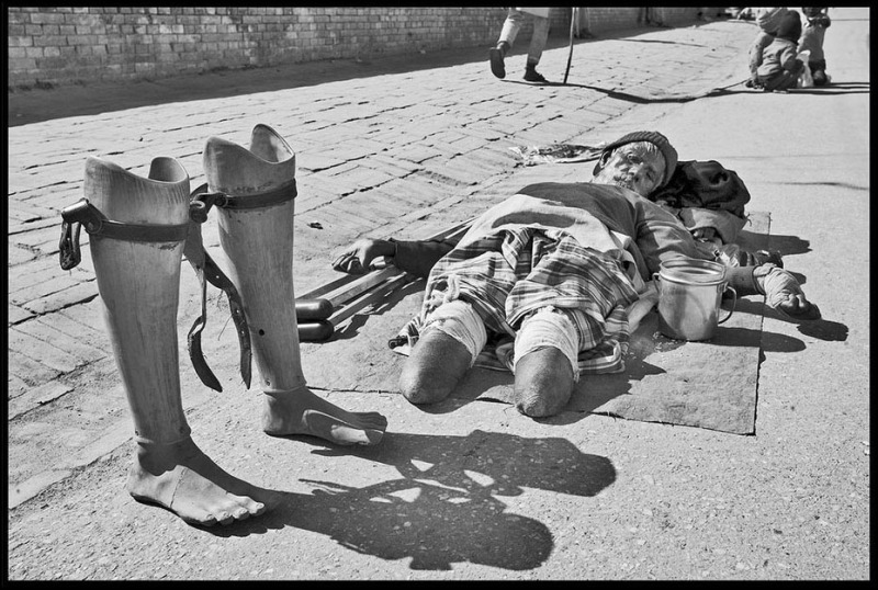 The Destitute Elderly © Dan Giannopoulos An elderly Beggar lays in the street outside Pashupati 